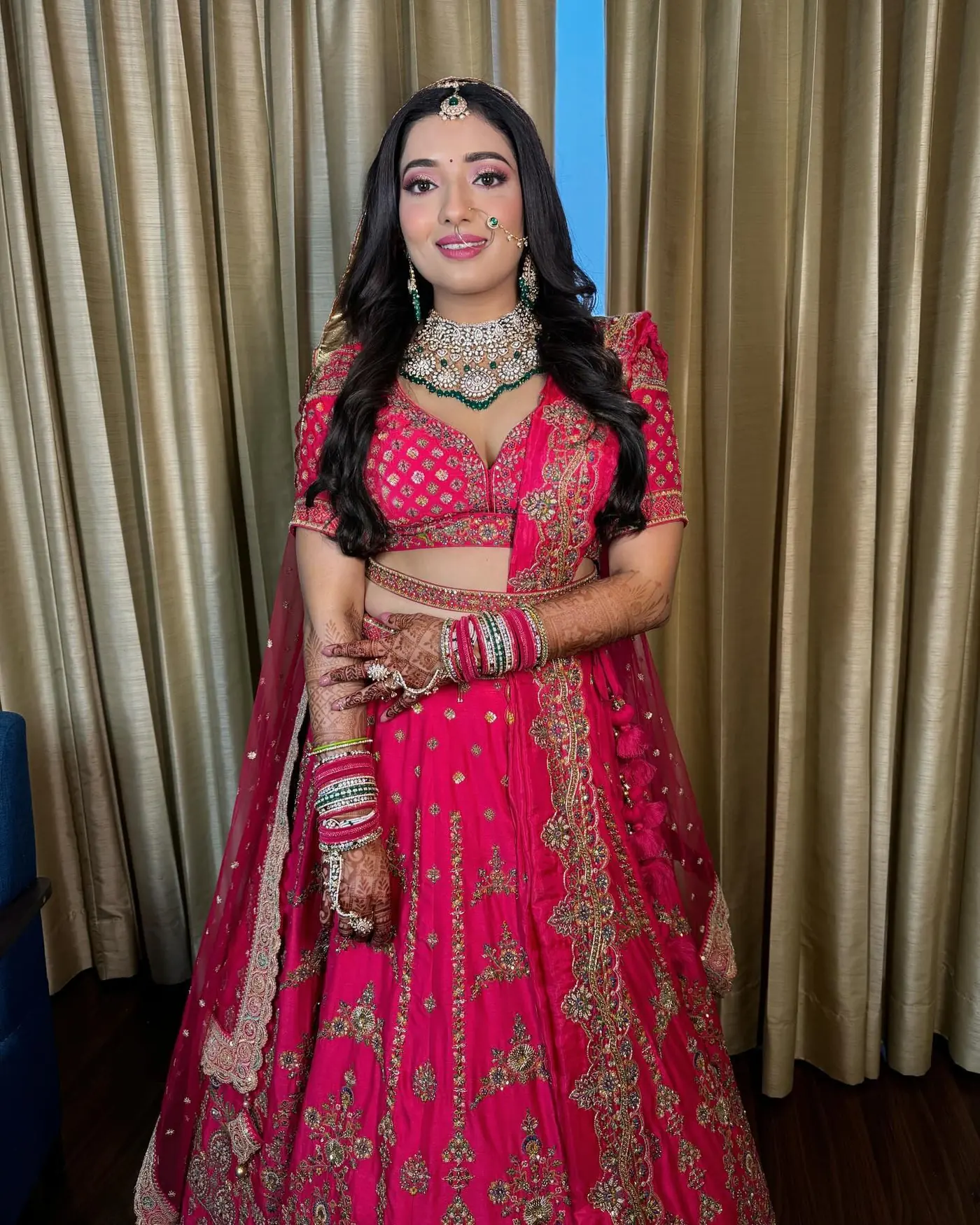 Rani Pink Lehenga, Curls. Bridal makeup by Madhu Gupta at MG Makeovers, Gurugram
